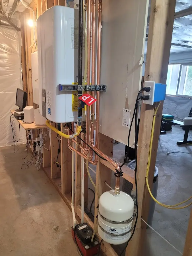 Licensed plumber repairing a kitchen sink in Gorham